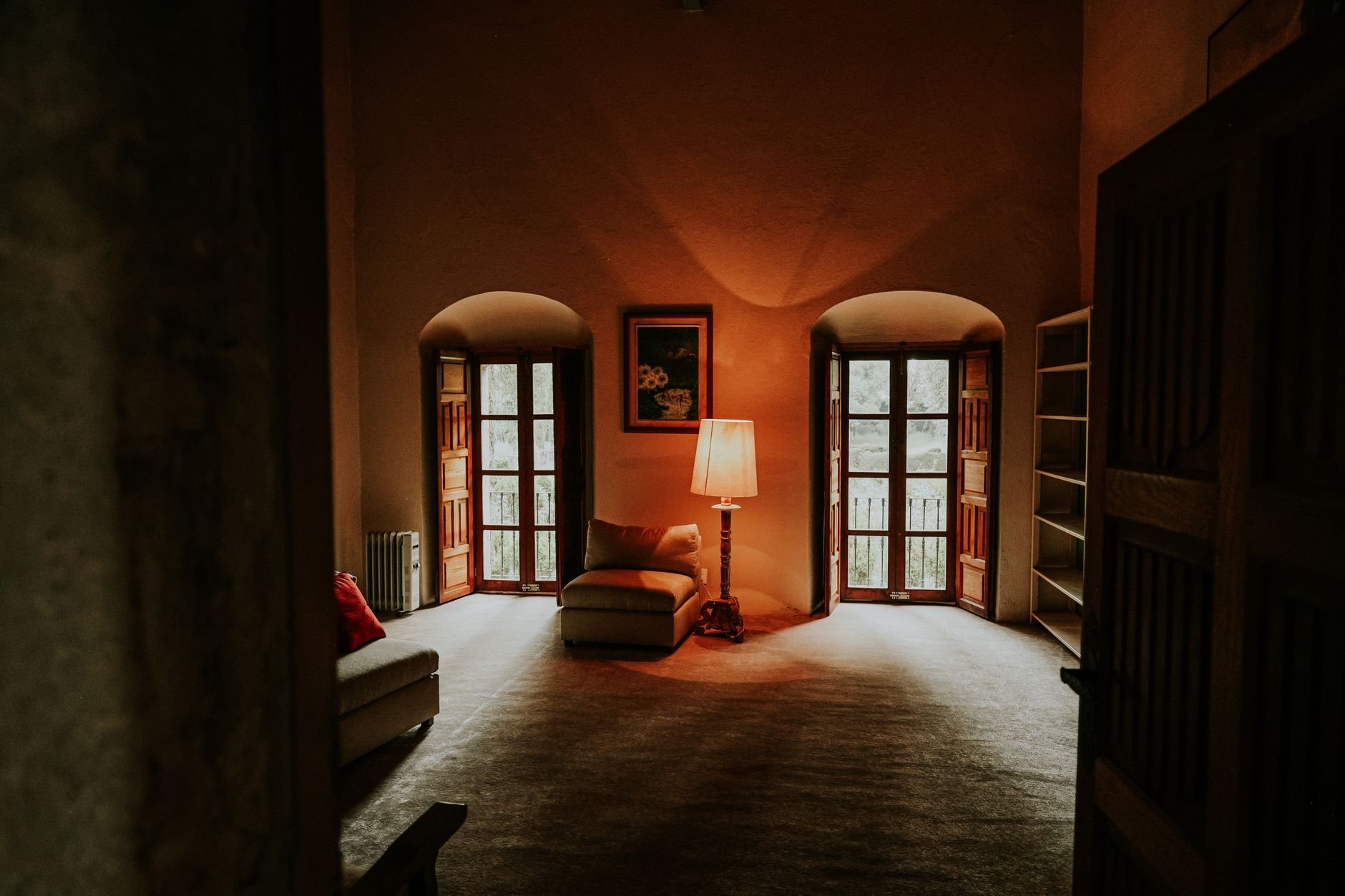 A warm and inviting rustic living room with vintage decor and cozy lighting.